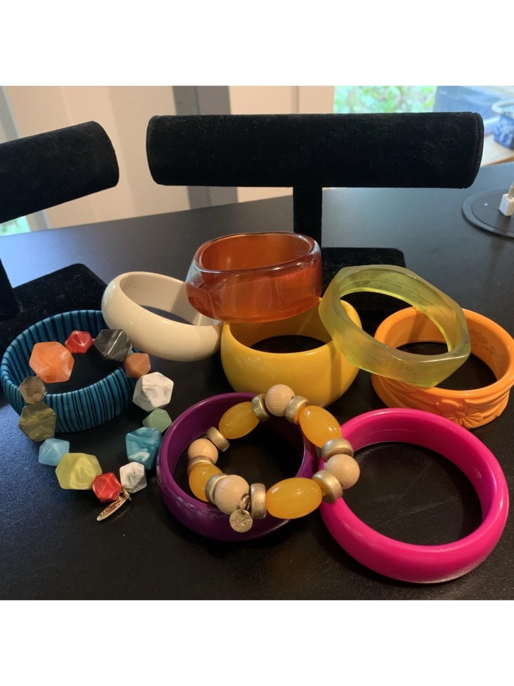 A collection of  Mixed-Color Bangles and Beaded Bracelets
